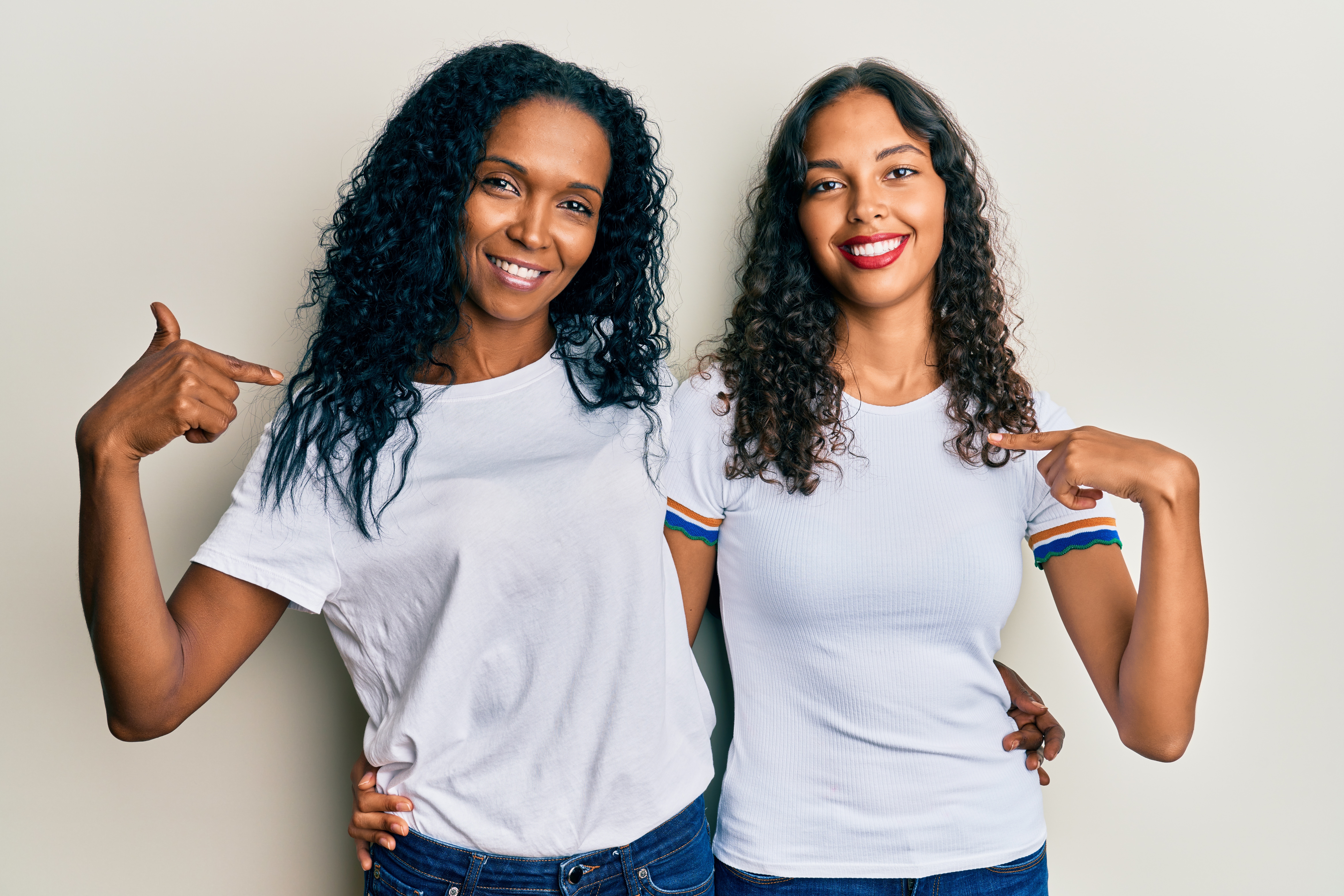 Two women in white t-shirts